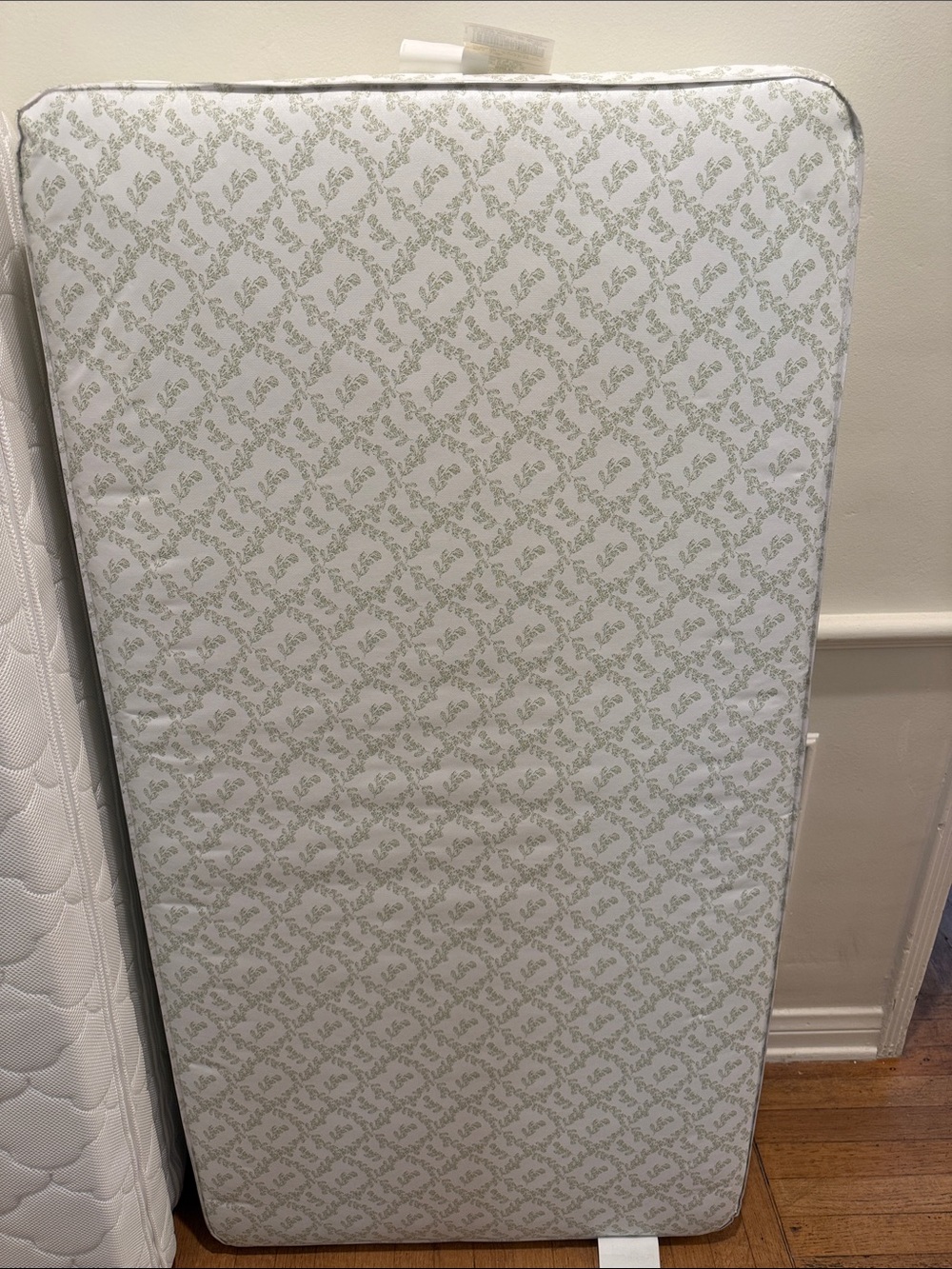 White and Light Green Patterned Crib Mattress